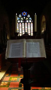 a bible on a stand in an old church