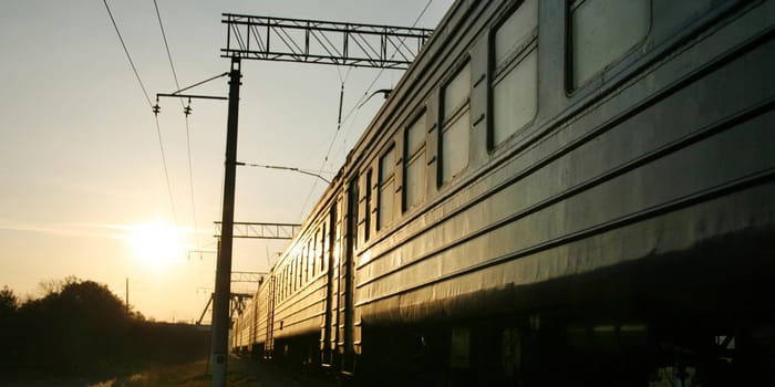 train on the railway track on sunset