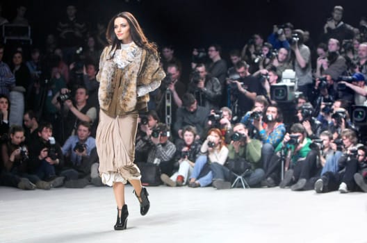 A model walks the runway presenting an outfit by Hanna Babenko of her Fall Winter 08/09 collection during the 22nd Ukrainian Fashion Week Saturday, March 15, 2008 in Kyiv