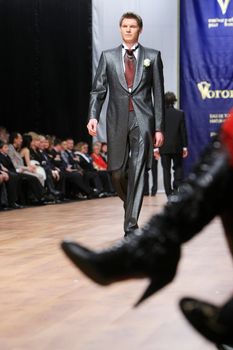 A model walks the runway demonstrating an outfit by Michael Voronin during the Trade Mark Defile Friday, Feb 29, 2008 in Kyiv.