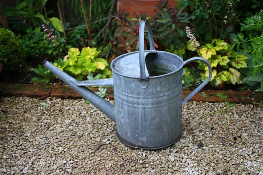 A lone, solitary watering can