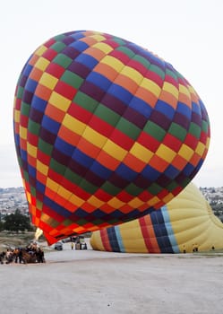 June 2011, Hot air balloon almost ready to take its passengers. Cappadocia, Turkey, Kapodokya