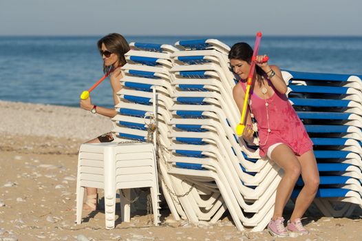 Crazy girls having a lot of fun at a water fight