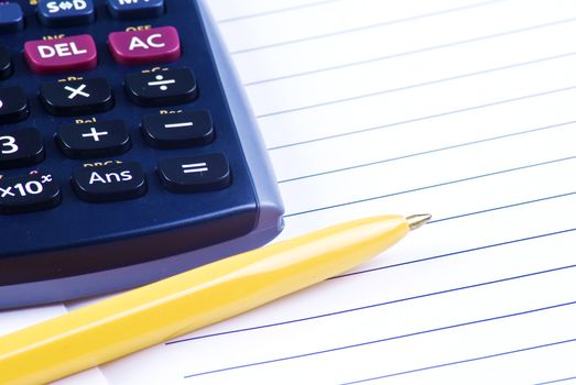 Calculator with notebook and pen