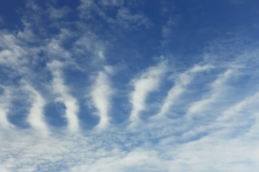 Stratospheric cumulus clouds against the background of blue sky