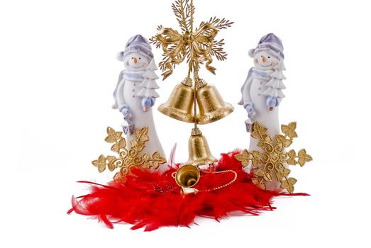 Christmas snowmans with golden bells and golden stars on the red feathers