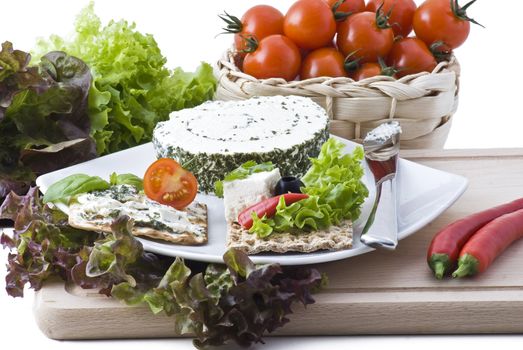 Heathly crackers with cheese, herbs, salad, tomato, olives and peppers