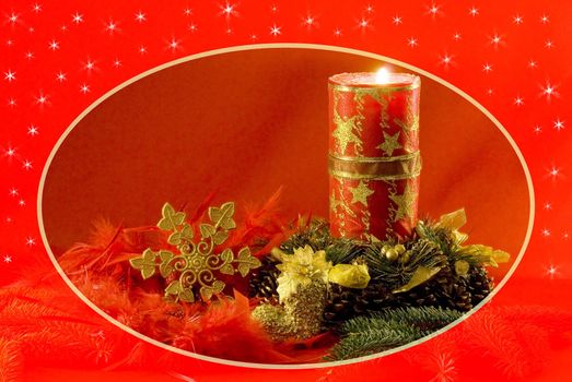 Christmas decorations - red candle, cones, golden snow star, spruce twig and red feathers