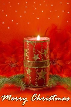 Christmas decorations - red candle, spruce twig and red feathers