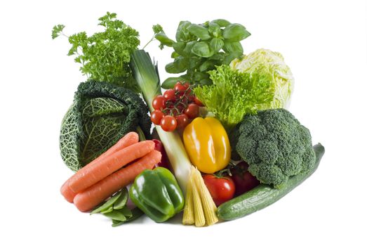 Fresh vegetables and herbs on the white background