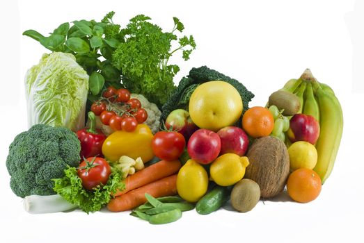 Fresh assorted fruits and vegetables on the white background - isplated