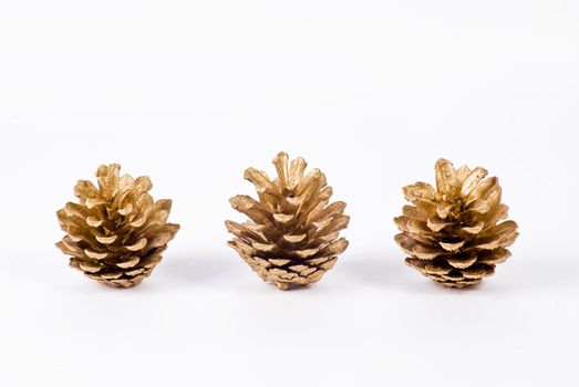 Christmas decoration of pine cones on white background