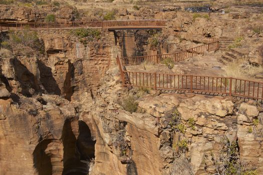 Railings around the top of the river canyon at Bourke's Luck Potholes on the Blyde River in Mpumalanga, South Africa