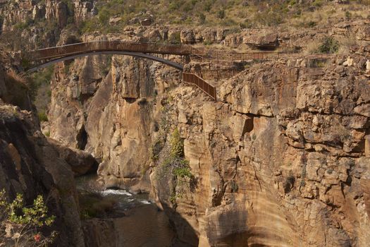 Bridge over the eroded river canyon at Bourke's Luck Potholes on the Blyde River in Mpumalanga, South Africa