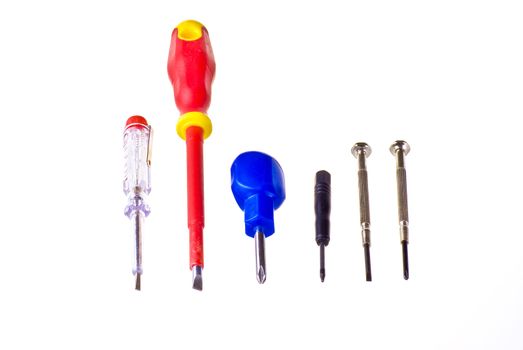 Various types of screwdrivers over white background