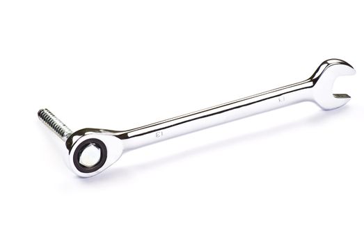 Stainless Steel Wrench and bolt over white background