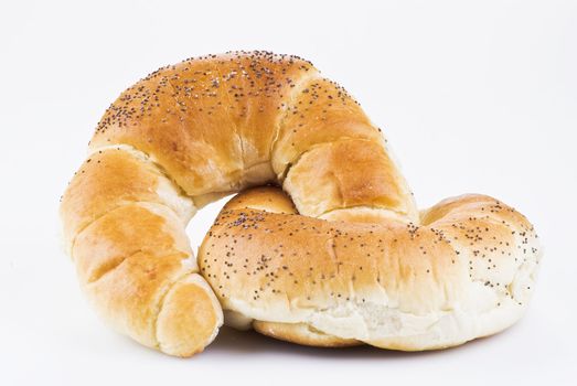 Two croissants with poppy isolated over white