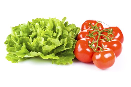 Fresh tomatoes and lettuce isolated over white background