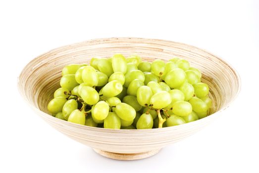 Grape fruits in wooden bowl - isolated over white