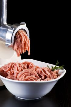 Bowl of mince with electric meat grinder