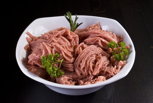 Bowl of raw minced pork with herbs
