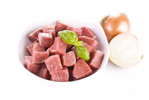 Diced beef with onion over white background