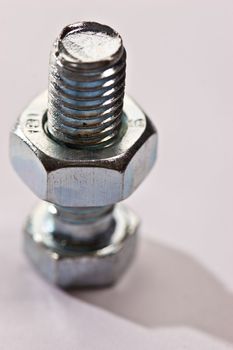 tools series: close up of steel bolt and screw-nut