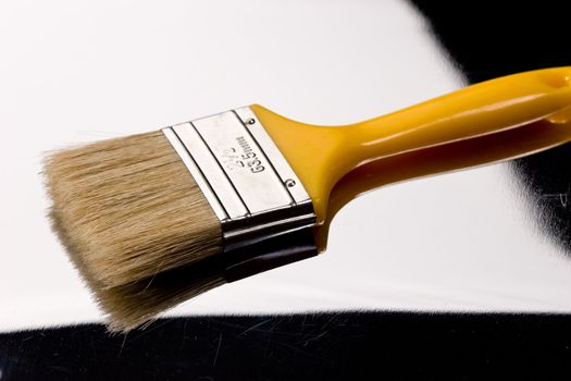 tools seriws: paint brush on the scratch 
 metal background