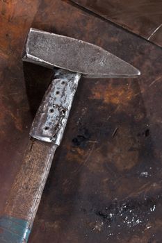 Two hammer on the workshop metall scratched surface