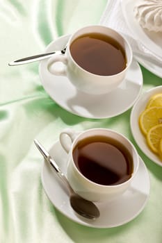white cup of tea with lemon and zephyr, hot drink