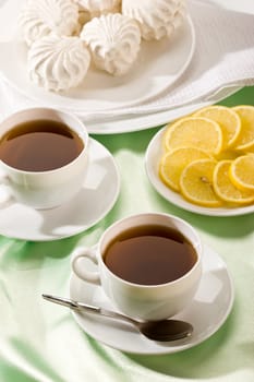 white cup of tea with lemon and zephyr, hot drink