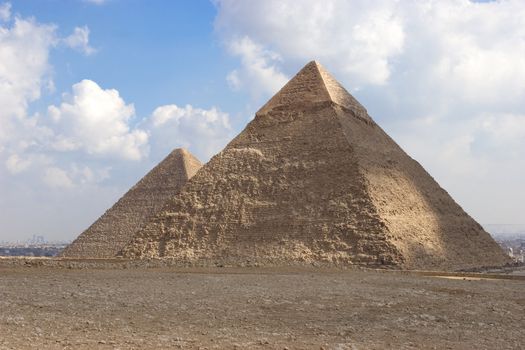 The Pyramid of Khafrae is the second largest of the Ancient Egyptian Pyramids of Giza and the tomb of the fourth-dynasty pharaoh Khafre (Chephren in Greek), The pyramid has a base length of 215.25 m (706 ft) and originally rises to a height of 143.5 m (471 ft).