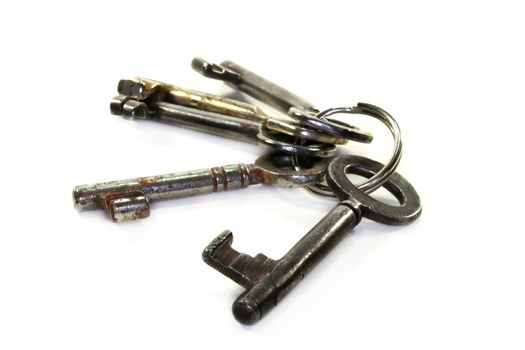 old bunch of keys on a white background