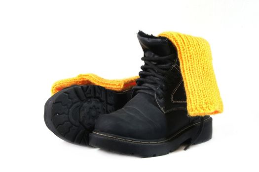 Winter shoes with yellow socks on a white background