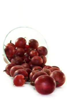 a handful of gooseberries on a white background