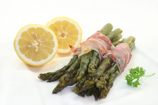 green asparagus with ham in the oven