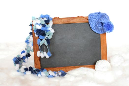 Blackboard with a hat and scarf