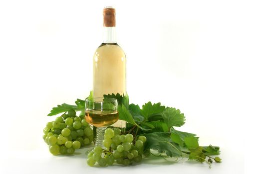 two bottles of wine with grapes and leaves