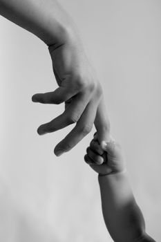 child hand hold by the adult hand