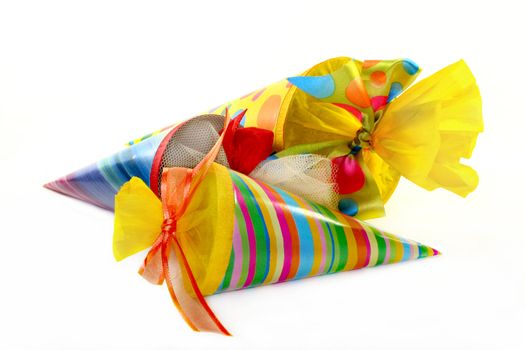 three colored school cones on a white background