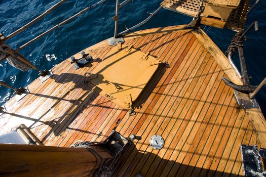 summer series: modern wooden yacht in the sea. Deck view