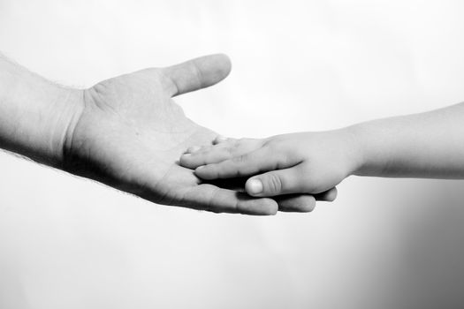 child hand hold by the adult hand