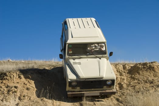 Enjoying driving a classic 4x4 car off road.