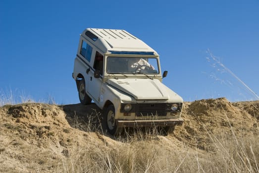 Enjoying driving a classic 4x4 car off road.