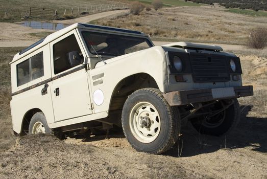 Enjoying driving a classic 4x4 car off road.