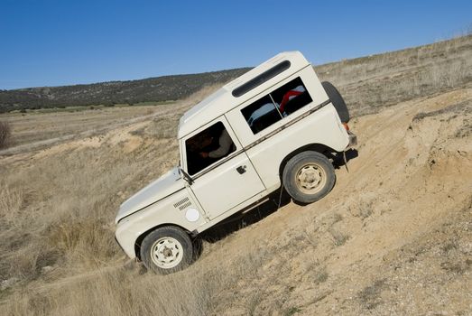 Enjoying driving a classic 4x4 car off road.