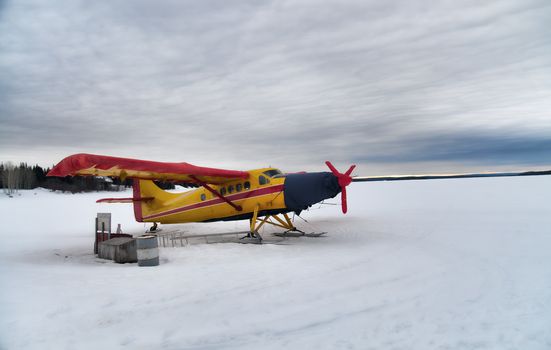 Landed hydro plane on a frozen lake
