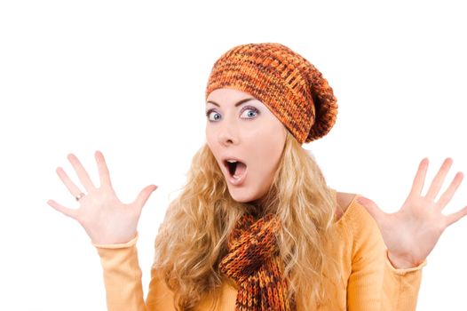 Surprised woman in hat and scarf over white