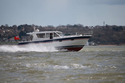 A boat speeding across the Solent