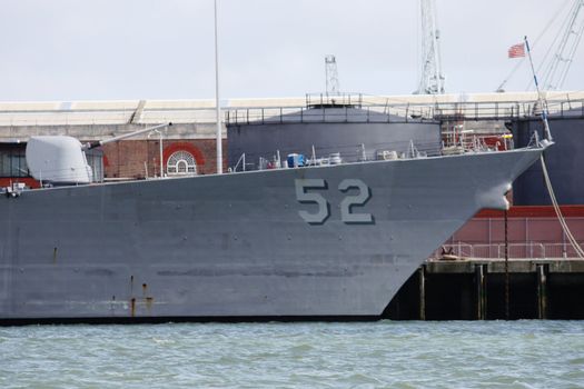 A moored warship, docked in Portsmouth Naval base